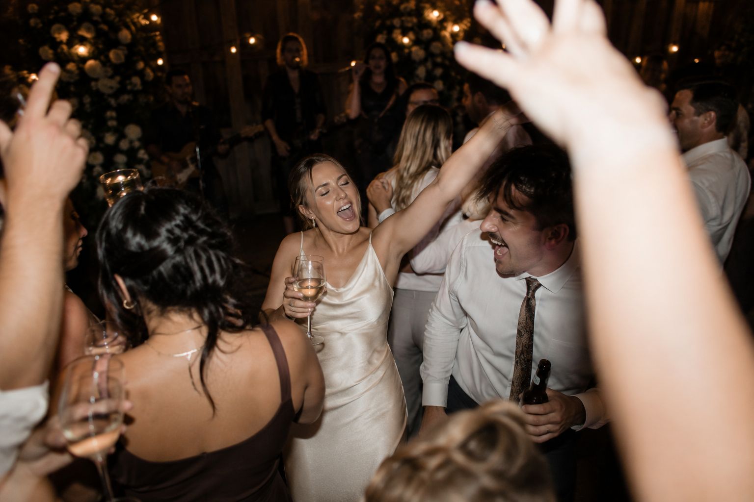 Bride dancing and singing on the dance floor