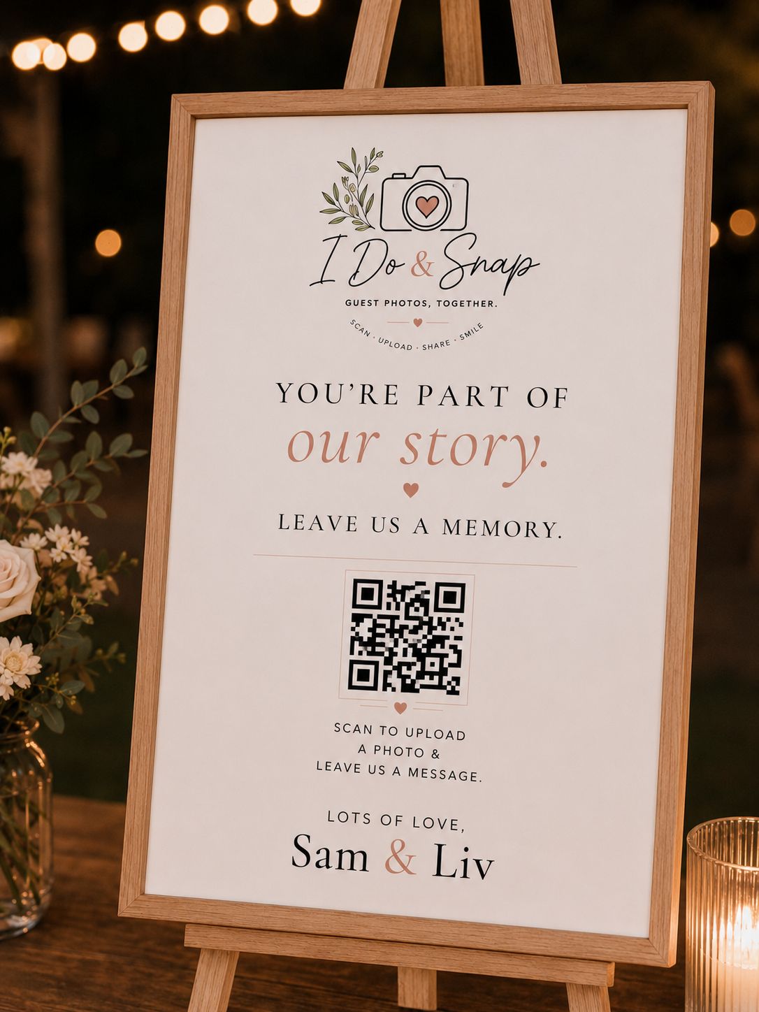 An I Do & Snap guest book QR sign on an easel at a wedding