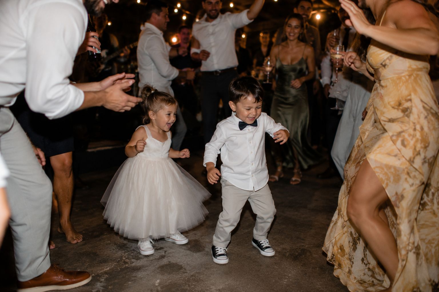 Flower girl and page boy dancing